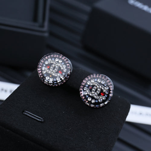 Rhinestone Chanel-style round stud earrings with black enamel and red accents
