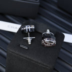 Set of two round rhinestone stud earrings with black enamel and silver posts