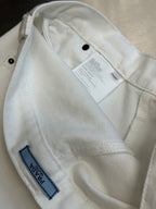 Prada off-white pants with inner waistband lining and hanging care label