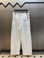 Off-white cargo pants with multiple flap pockets and belt loops