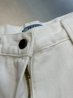 Off-white cargo pants waistband with PRADA-style logo tag and button