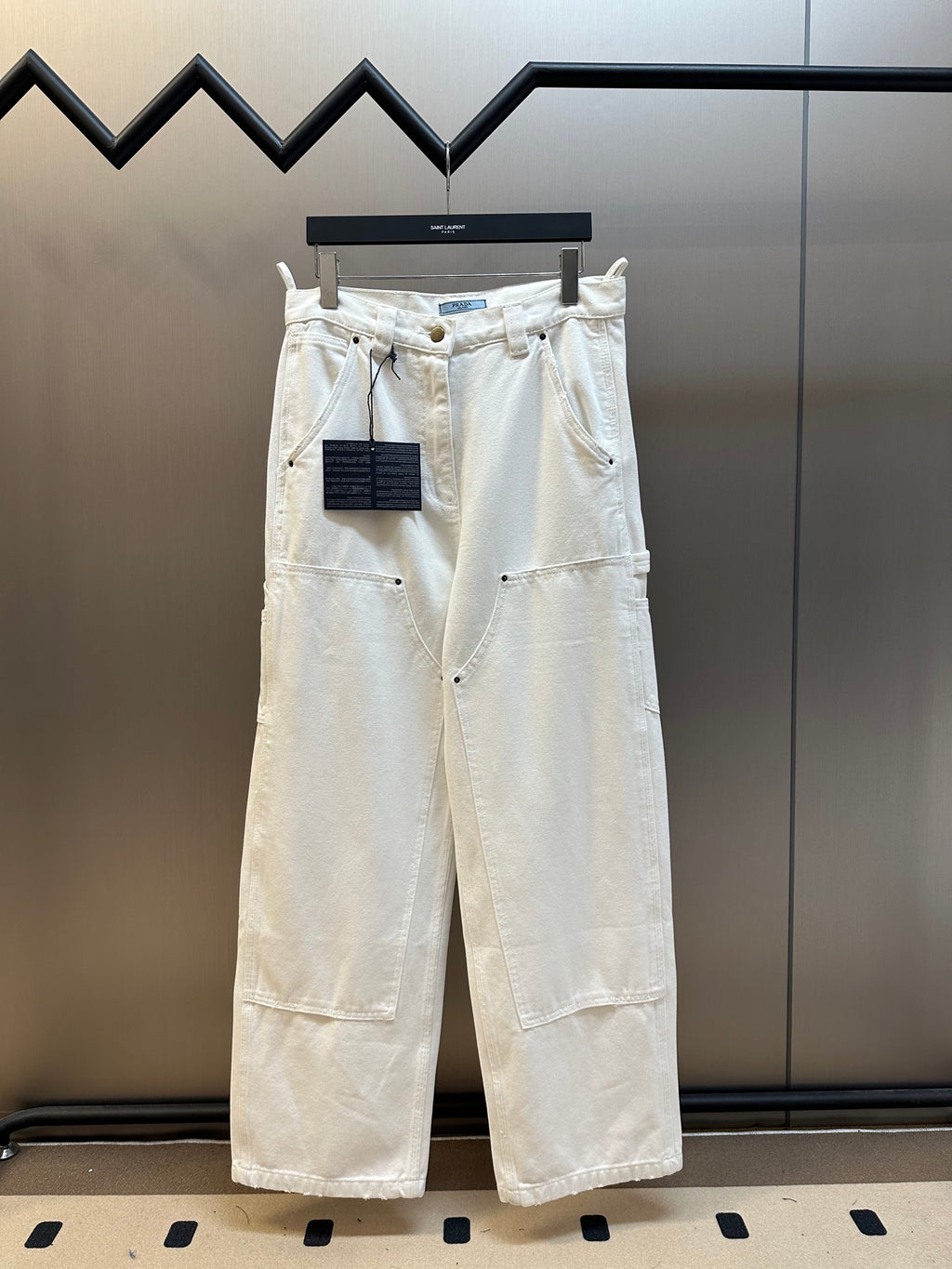 Off-white wide-leg cargo pants with button fly and belt loops