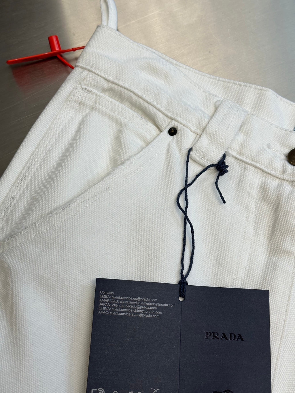 Off-white cargo pants waistband detail with drawstring and hanging label