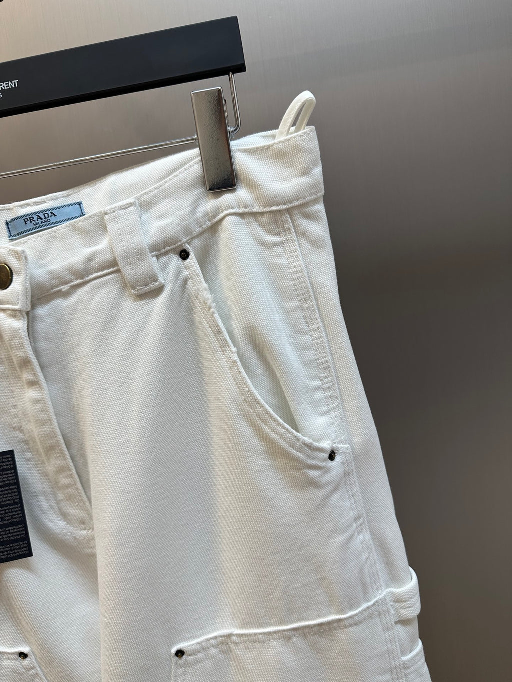 Off-white cargo pants front detail with button closure and side pocket