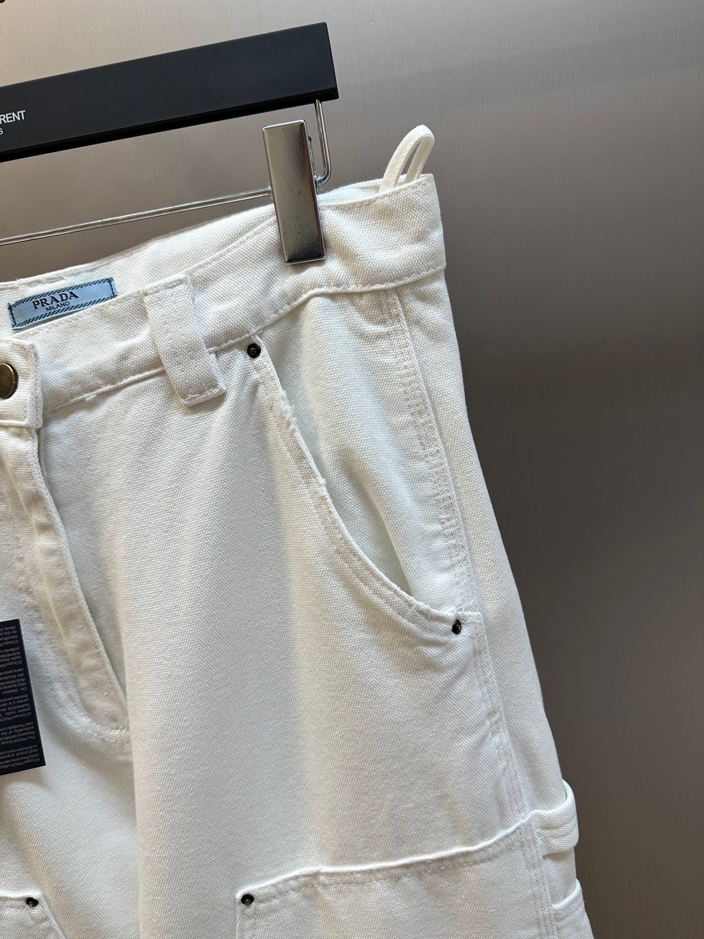 Off-white cargo pants front detail with button closure and side pocket