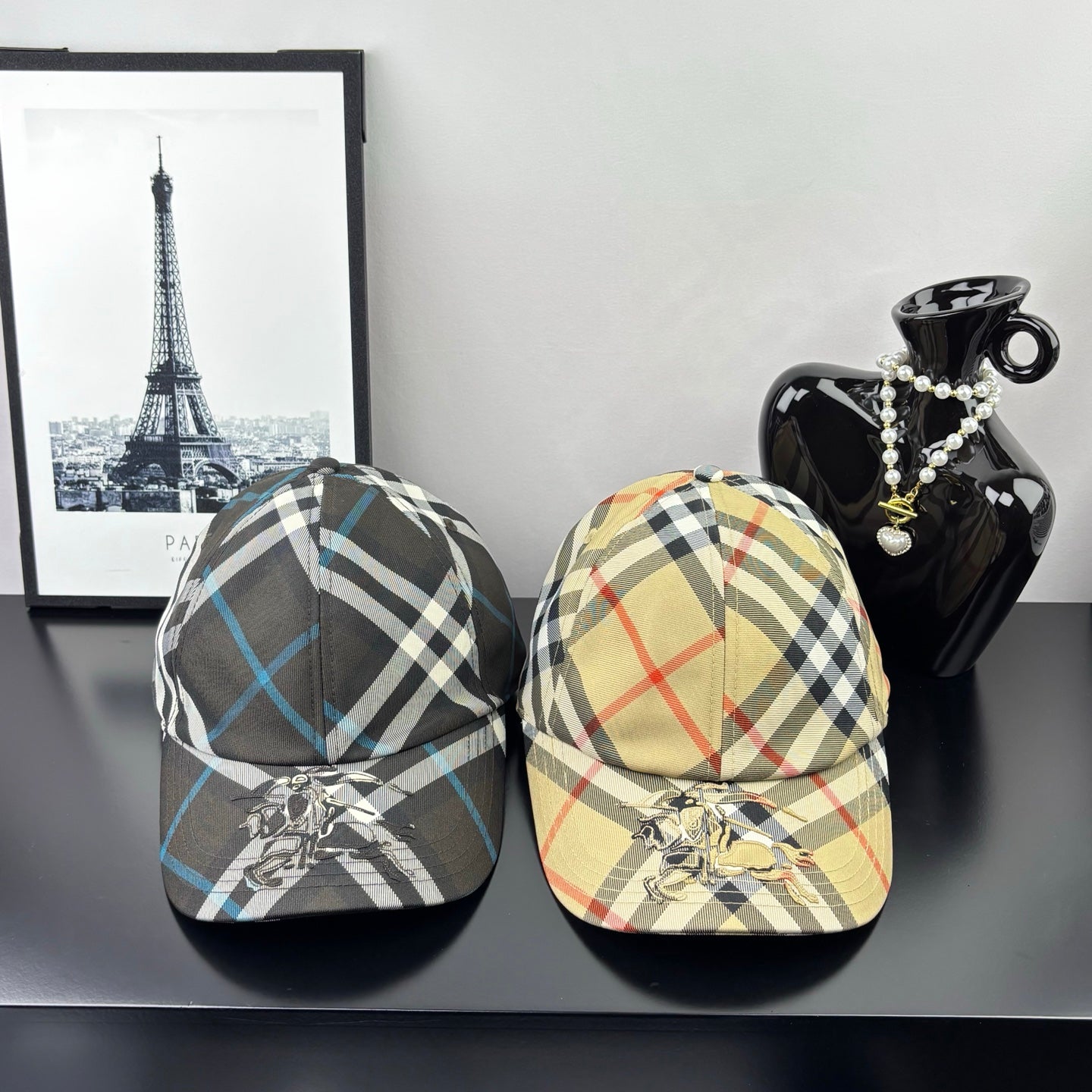 Burberry plaid baseball caps set: beige-and-red check and dark blue-and-black check, curved brim.