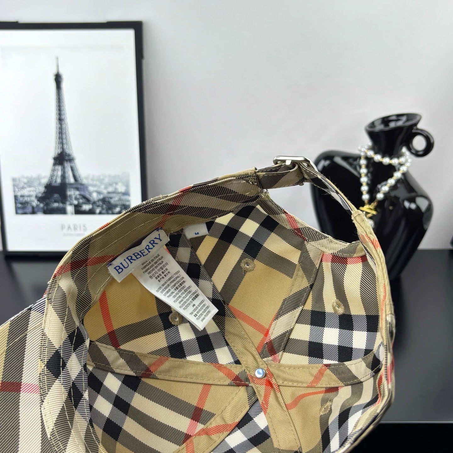 Burberry plaid baseball cap, beige interior with black-and-red check panels and clip strap.