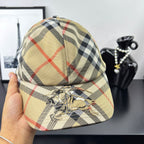 Burberry plaid baseball cap, beige base with black and red cross pattern, front emblem detail.