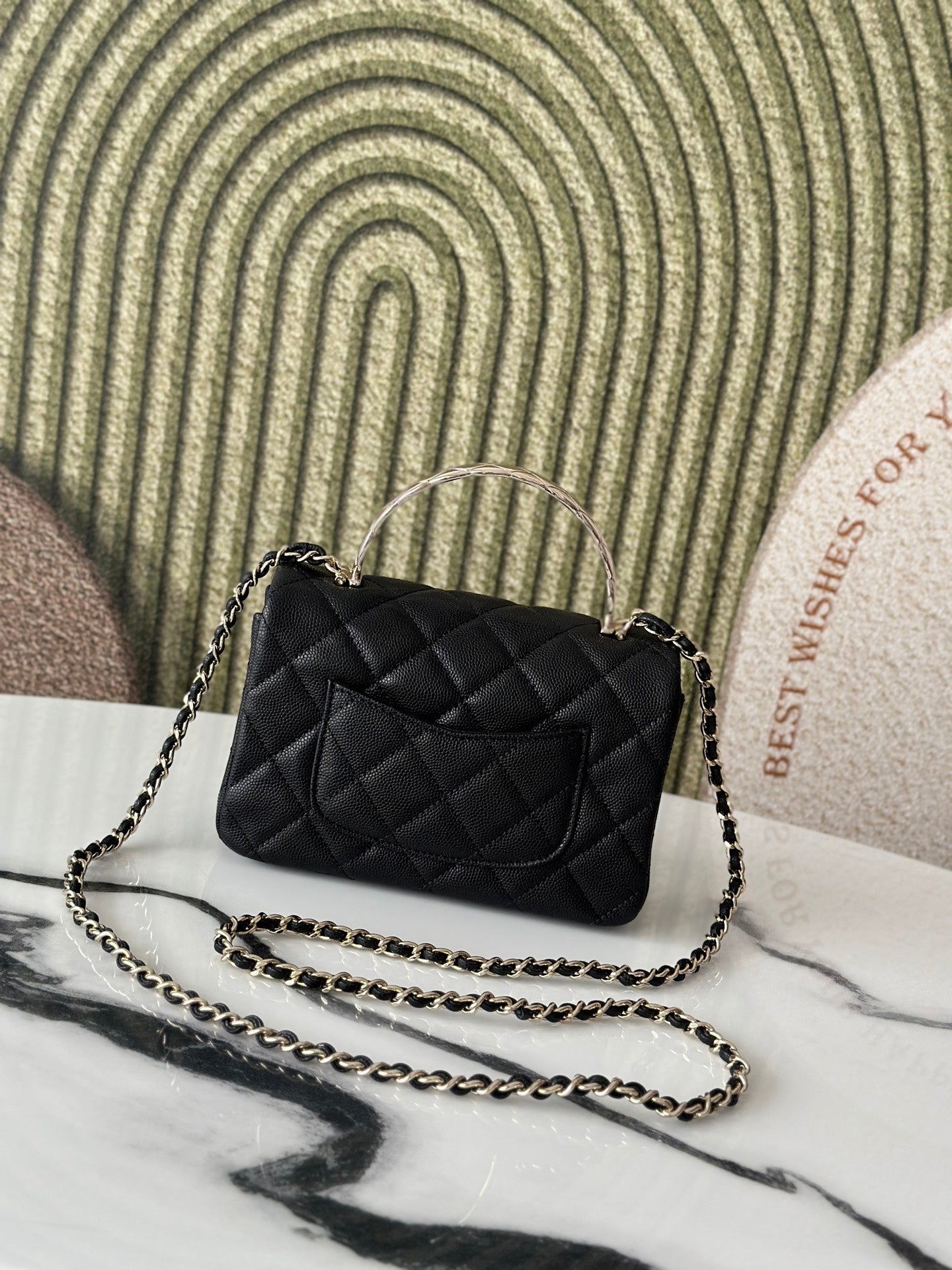 Chanel bag, black quilted leather with CC logo and long chain strap