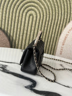 Chanel bag, black quilted leather with chain shoulder strap
