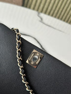 Chanel bag, gold-tone logo plaque and chain on textured black leather