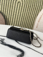 Chanel bag, black quilted leather with gold-tone hardware and chain crossbody