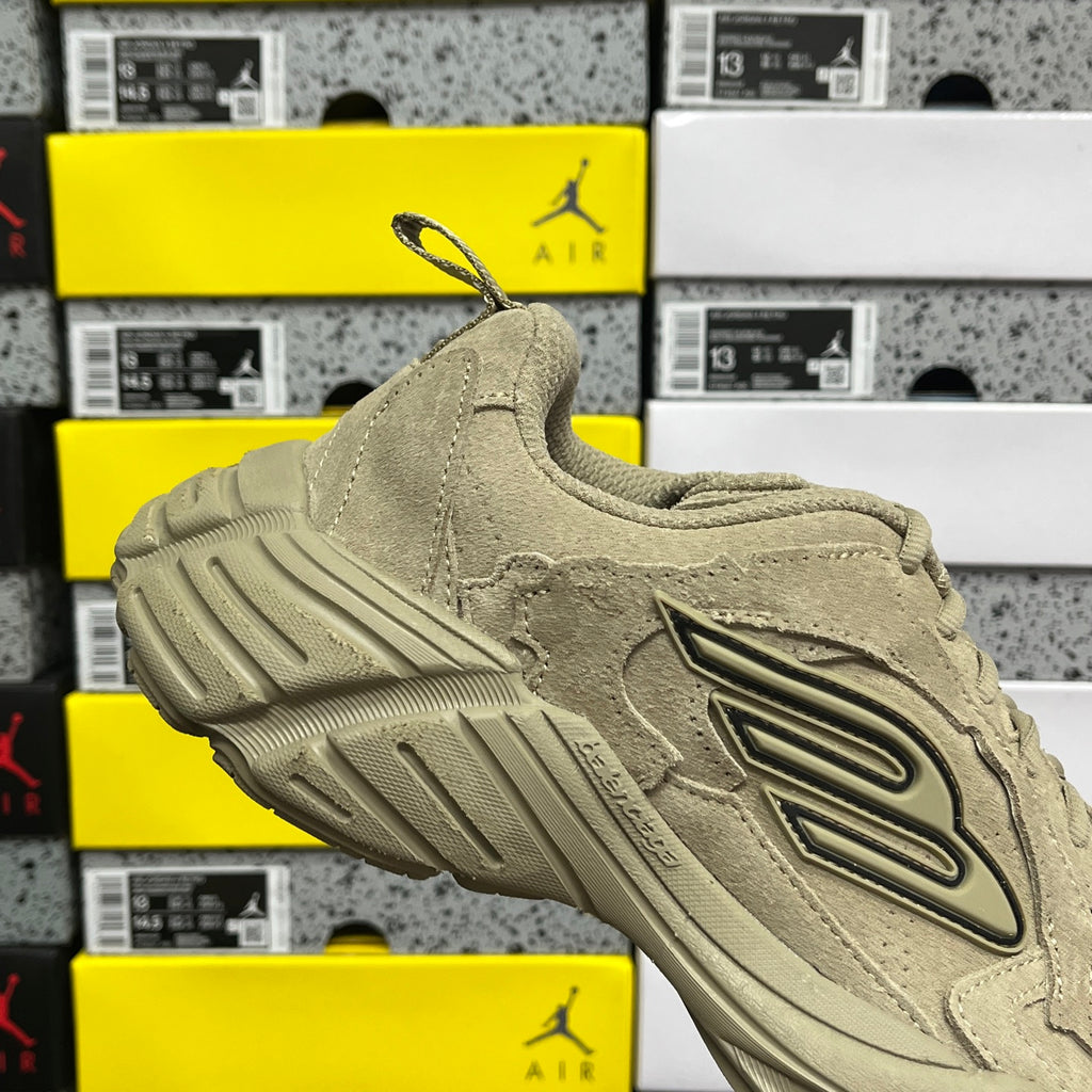 Beige suede lace-up sneaker with large side logo and chunky tread sole
