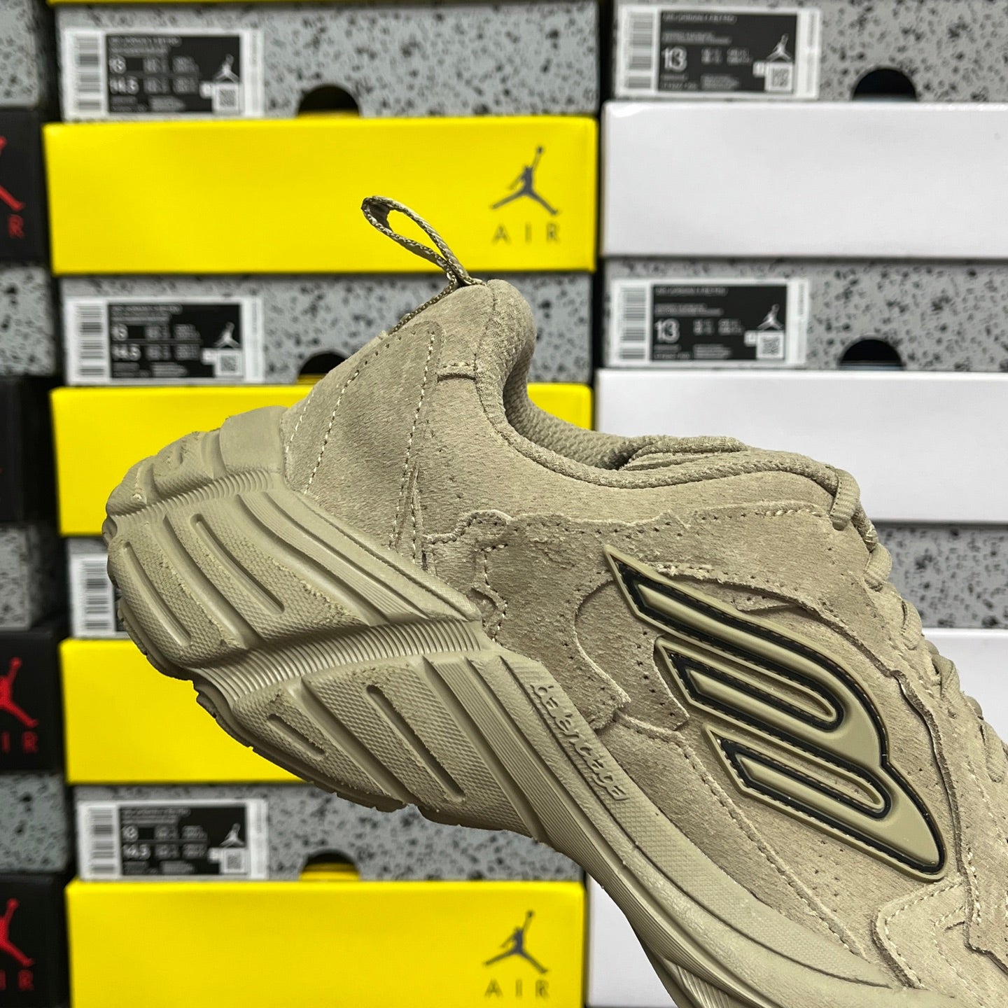 Beige suede lace-up sneaker with large side logo and chunky tread sole