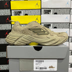 Beige suede lace-up sneaker on box, side logo and textured midsole