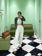 Prada white wide-leg pants with front pockets and button closure