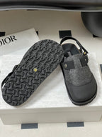 Dior sandals showing embossed outsole; gray textured upper with black cross strap