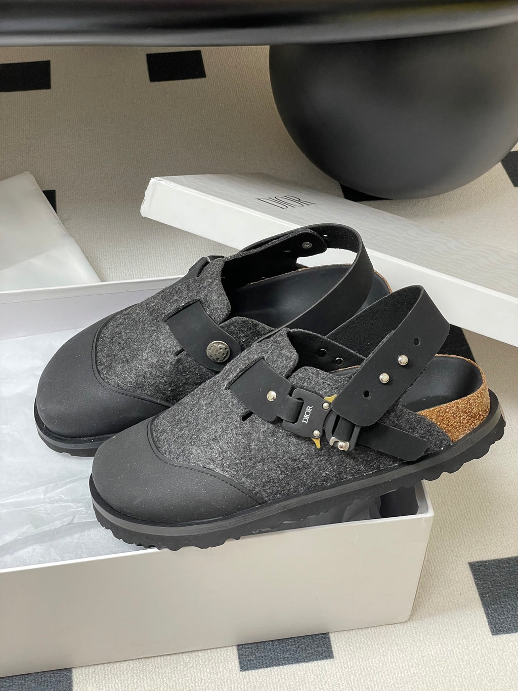 Dior mule sandals in box: gray textured footbed, black straps, gold studs and buckle