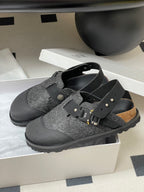 Dior mule sandals in box: gray textured footbed, black straps, gold studs and buckle
