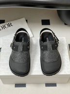 Dior sandals with gray textured uppers and black straps; gold-toned hardware on front