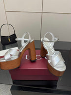 Gucci white heeled platform sandals with crisscross straps on wooden soles