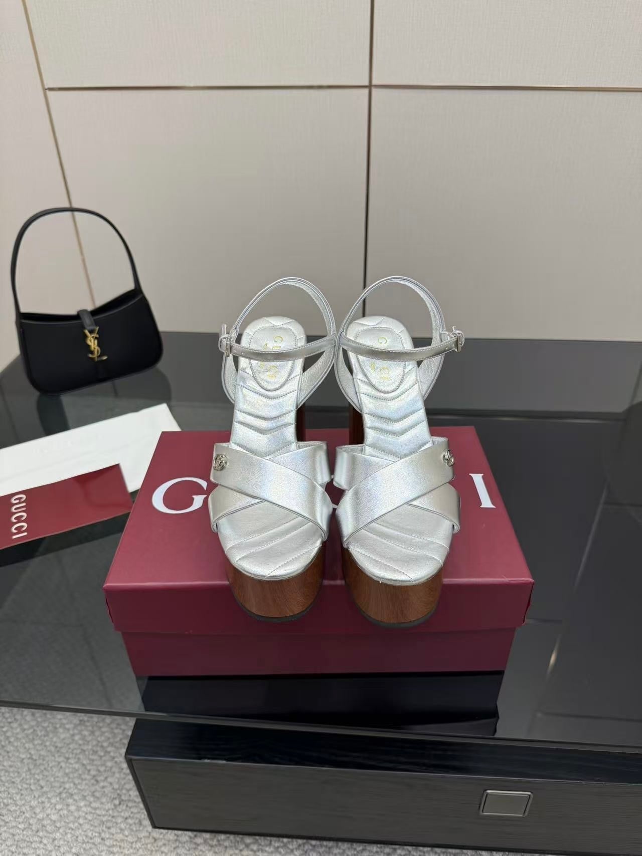 Gucci white leather platform heeled sandals with black mini handbag