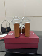 Gucci white platform heeled sandals on tall wooden heels with black mini handbag