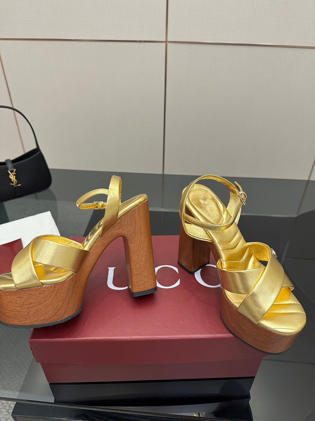 Gucci gold platform sandals with double straps and thick wood heel