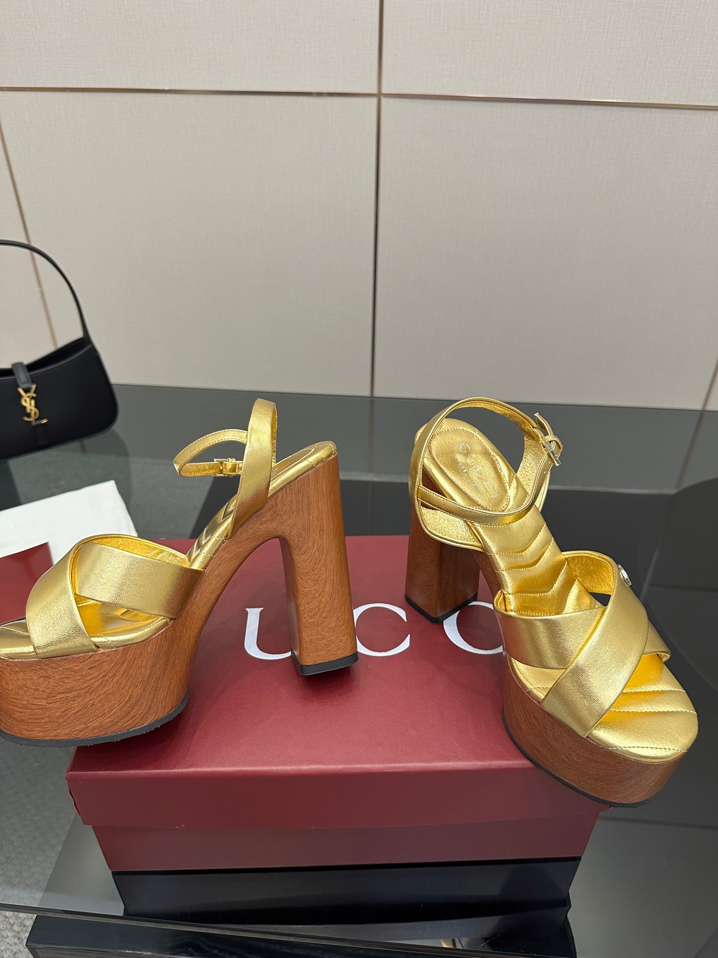 Gucci gold platform sandals with double straps and thick wood heel