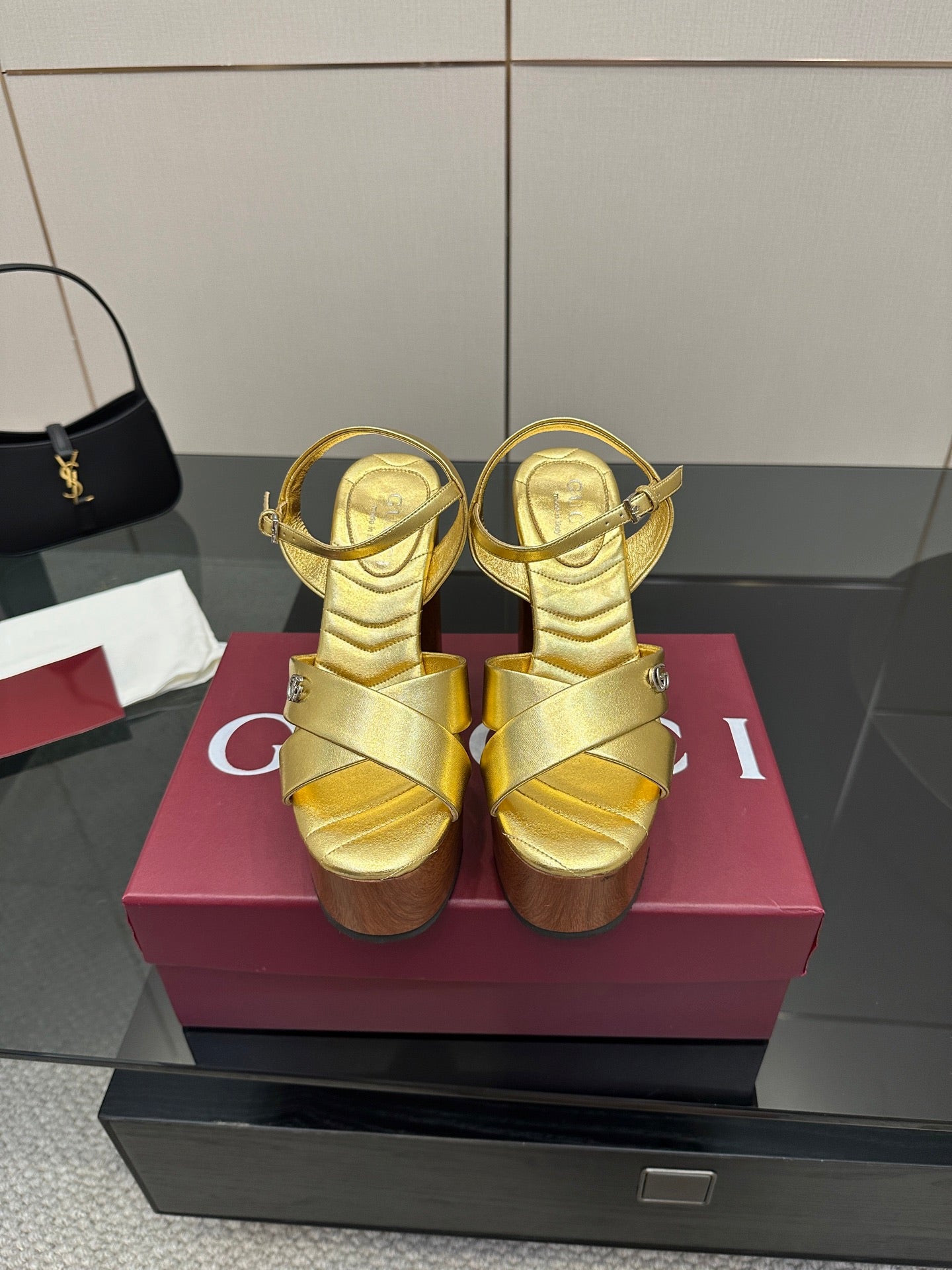 Gucci gold platform sandals with ankle strap and crisscross straps, chunky wood heel