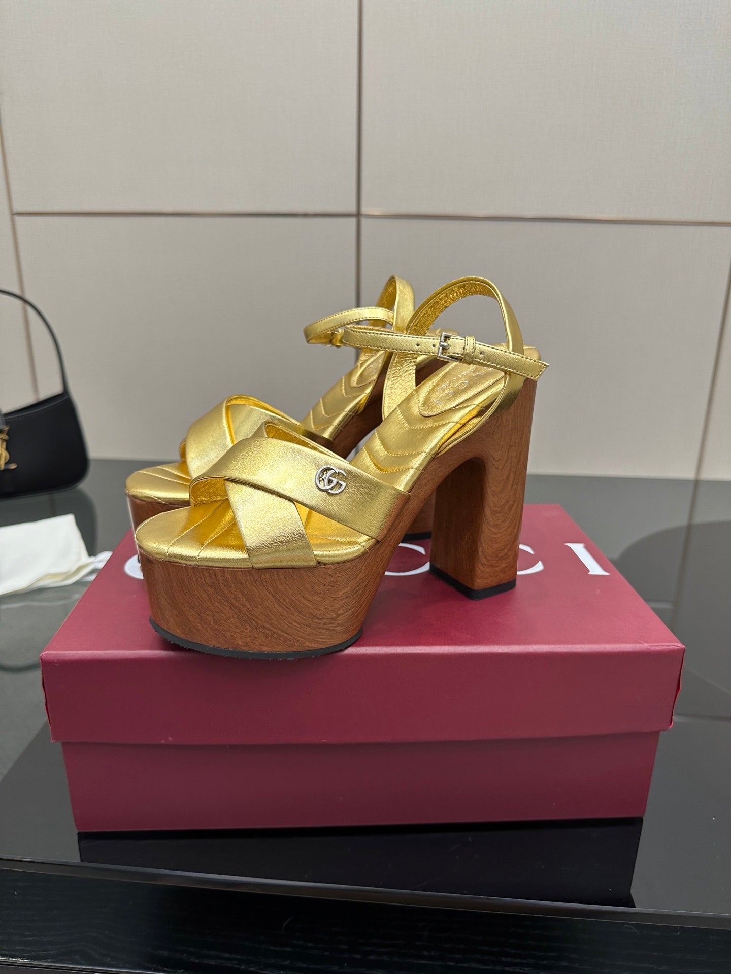 Gucci gold heeled platform sandals with wide straps and wood block heel