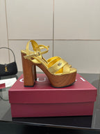 Gucci gold platform heeled sandals with ankle strap and open-toe, chunky wood heel