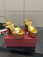 Gucci gold platform heeled sandals, ankle strap and cross over straps on wood sole