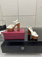 Gucci ladies white platform heeled sandals, side profile with wooden-style platform