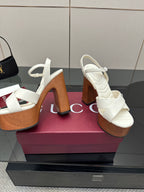 Gucci ladies white platform heeled sandals shown from the side with thick heel
