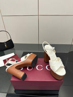 Gucci ladies white platform heeled sandals with crisscross straps and chunky heel