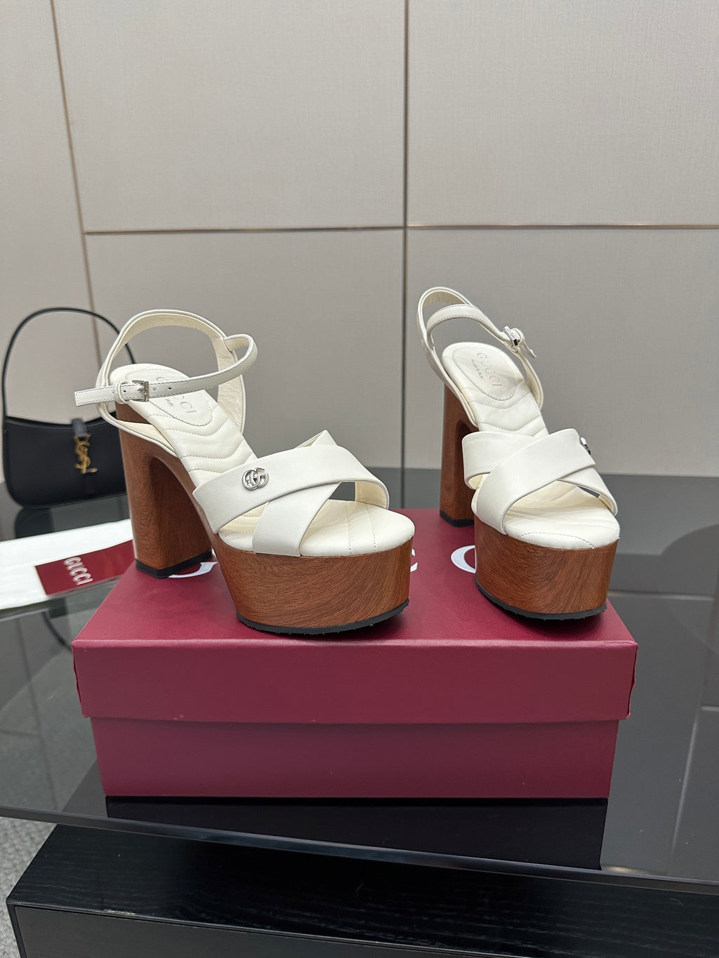 Gucci ladies white platform heeled sandals, side view on a display box