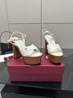 Gucci ladies white platform heeled sandals, side view on a display box