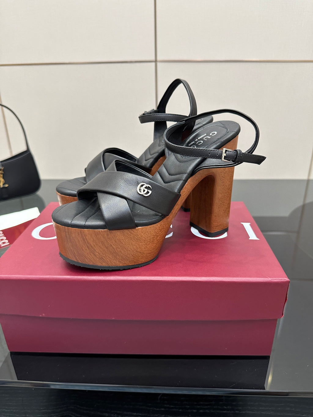 Gucci black platform heeled sandals with wide straps and wood-look block heel