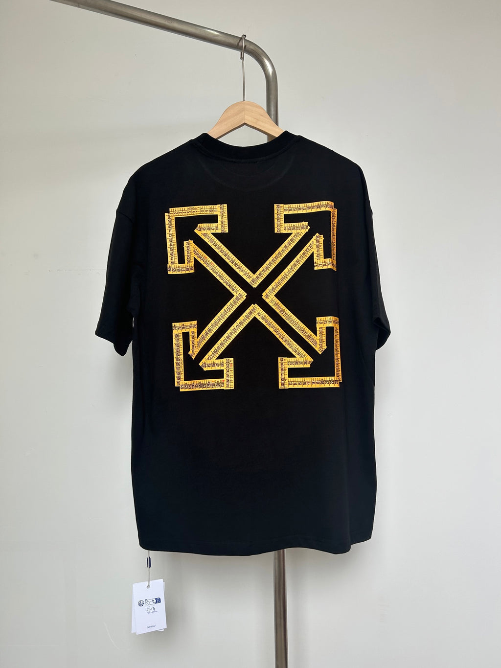 Dark graphic T-shirt with yellow Off-White™ arrow X logo