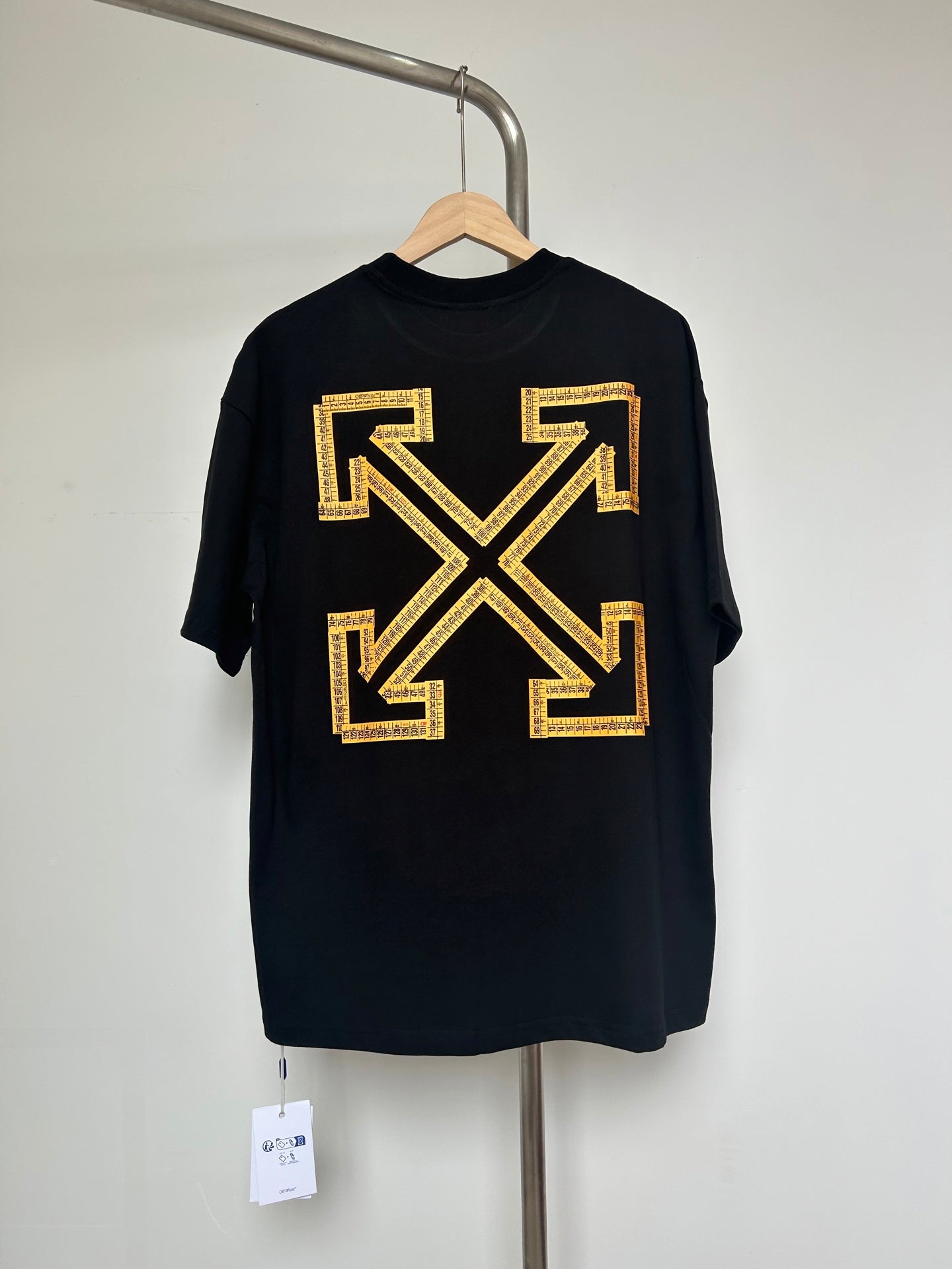 Dark graphic T-shirt with yellow Off-White™ arrow X logo