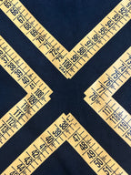 Off-White arrow graphic and numbers pattern on dark T-shirt fabric