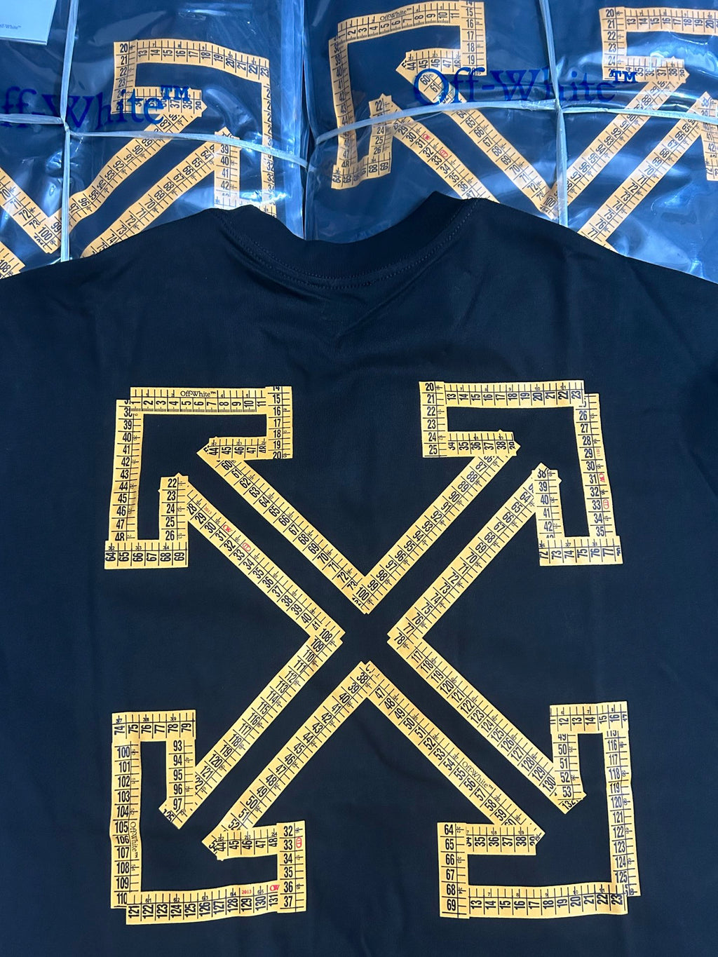 Off-White T-shirt with large gold arrow X graphic on dark front