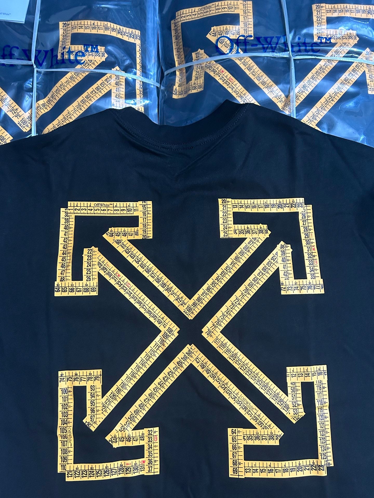 Off-White T-shirt with large gold arrow X graphic on dark front