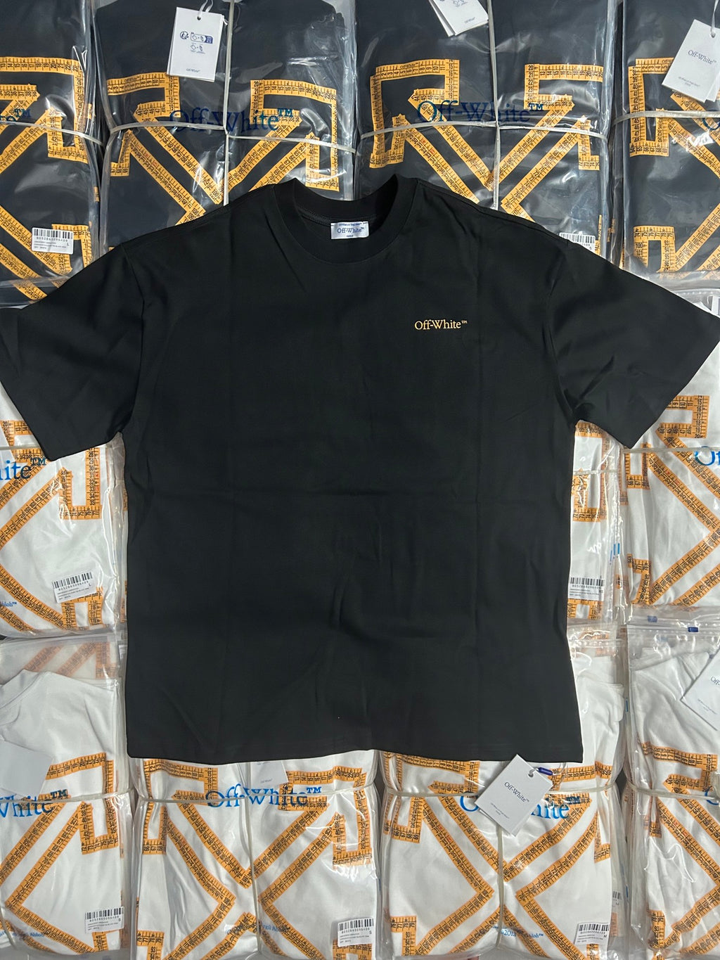 Off-White T-shirt front view with small Off-White logo on dark fabric