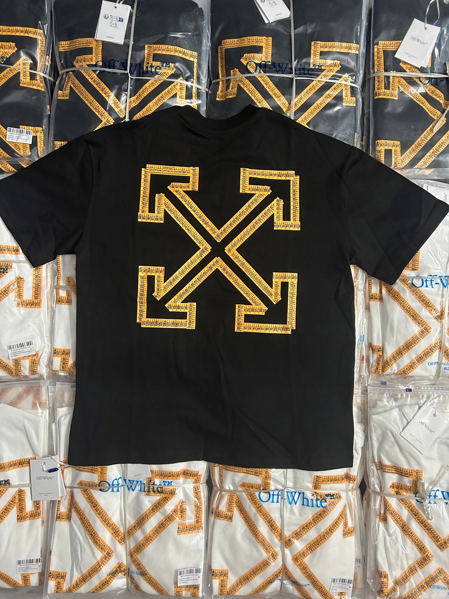 Off-White T-shirt with large gold arrow X graphic on dark front