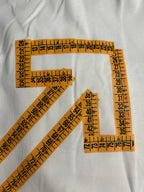 Off-White T-shirt close-up with orange ruler-lined arrow X graphic