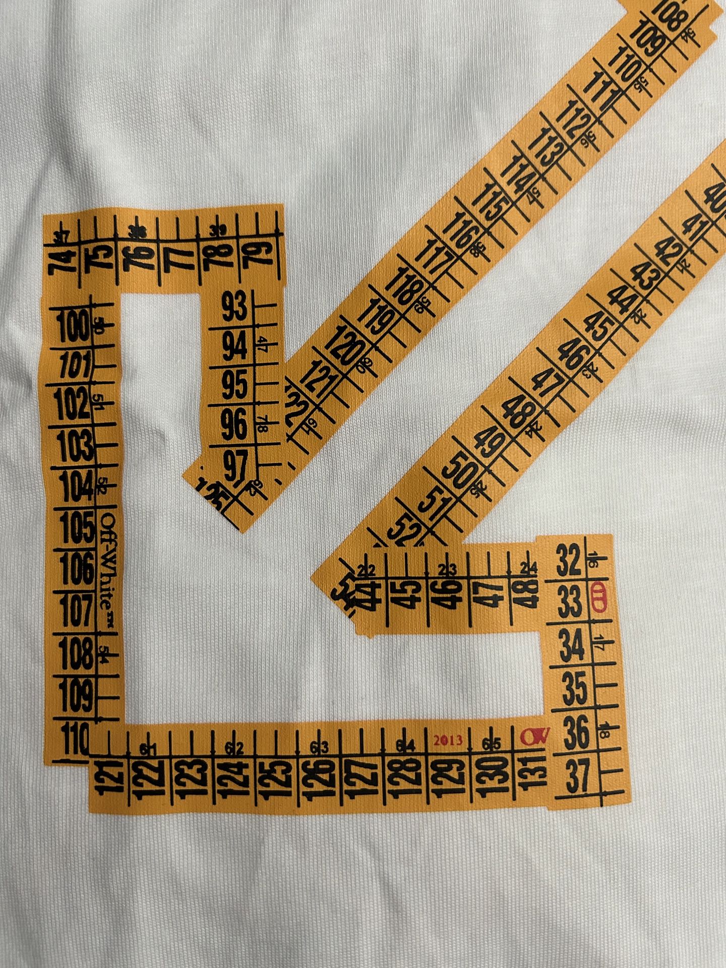 Off-White T-shirt with orange arrow and ruler-measurement patch graphic