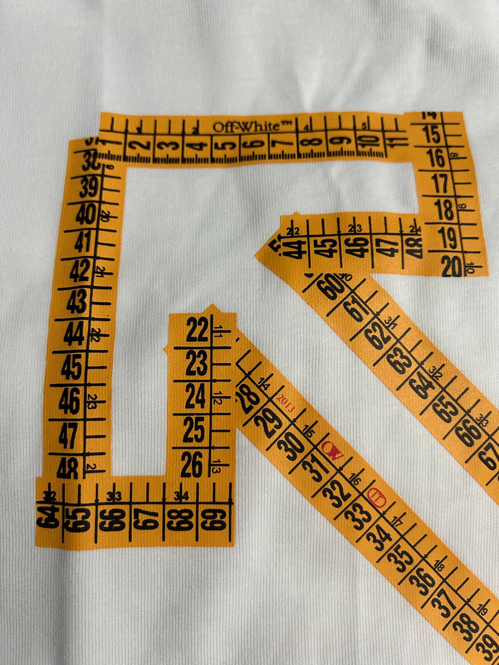 Off-White off-white T-shirt detail with orange measurement-style grid and X