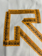 Off-White off-white T-shirt detail with orange measurement-style grid and X
